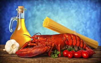 Ingredients of lobster with linguine on wooden table