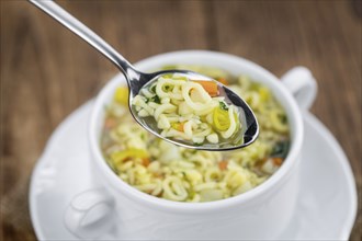 Portion of homemade Alphabet Soup (selective focus, close-up shot)