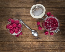 Fresh made Raspberry Jam on a vintage background as detailed close-up shot