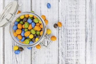 Chocolate coated peanuts as detailed close up shot (selective focus)