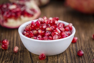 Portion of Pomegranate seeds (close-up shot, selective focus)