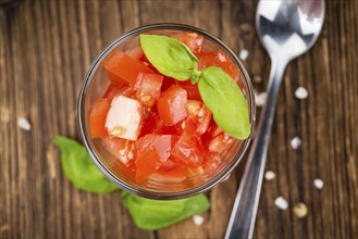 Diced Tomatoes on a vintage background as detailed close-up shot (selective focus)