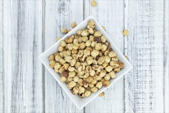 Peeled Hazelnuts as detailed close up shot (selective focus)