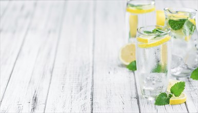 Lemonade on a vintage background as detailed close-up shot (selective focus)