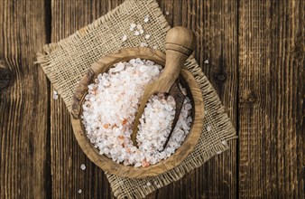 Pink Salt on a vintage background as detailed close-up shot (selective focus)