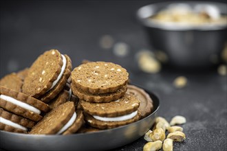 Portion of fresh made Hazelnut Cream Cookies as detailed close up shot (selective focus)