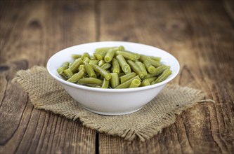 Portion of preserved Green Beans as detailed close-up shot (selective focus)