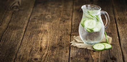 Cucumber Water on a vintage background as detailed close-up shot, selective focus