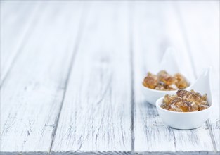 Portion of brown Rock Candy as detailed close-up shot (selective focus)