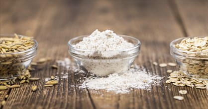 Portion of fresh Oat Flour on an old wooden table