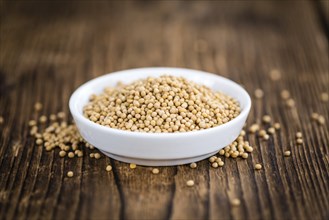 Mustard Seeds on a vintage background as detailed close-up shot (selective focus)