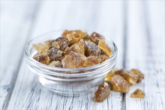 Portion of brown Rock Candy as detailed close-up shot (selective focus)