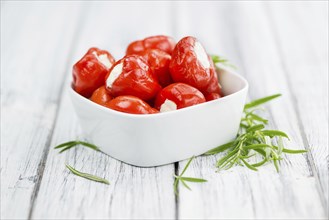 Homemade Filled Pimientos on vintage background (selective focus, close-up shot)