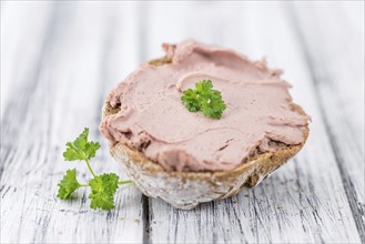 Liverwurst Sandwich on a vintage background as detailed close-up shot (selective focus)