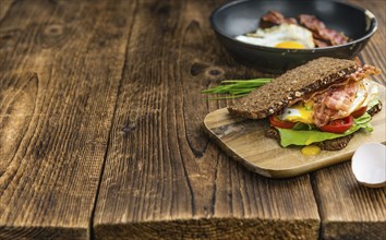 Fresh made Bacon and Egg Sandwich (selective focus, close-up shot)