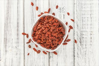 Goji Berries on a vintage background as detailed close-up shot (selective focus)