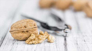 Walnuts on a vintage background as detailed close-up shot (selective focus)