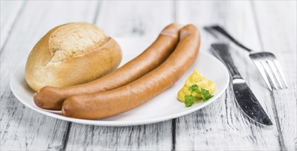 Fresh made German Sausages (Wiener) on a vintage background (close-up shot)