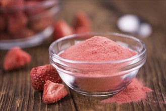 Fresh made Strawberry powder on an old and rustic wooden table, selective focus, close-up shot