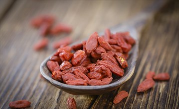 Goji Berries on a vintage background as detailed close-up shot (selective focus)