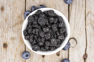 Dried Blueberries on a vintage background as detailed close-up shot, selective focus