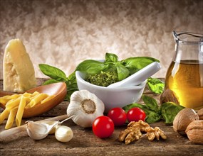 Italian pesto ingredients on wooden table