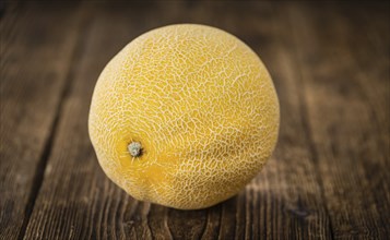 Honeydew Melon on a vintage background as detailed close-up shot (selective focus)