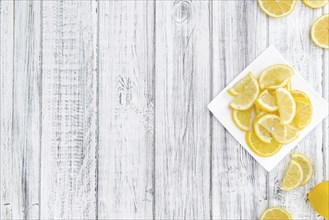 Lemon Slices on a vintage background as detailed close-up shot (selective focus)