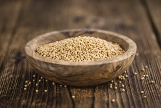 Mustard Seeds on rustic wooden background (close-up shot)