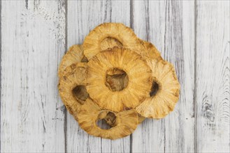 Some homemade Dried Pineapple Rings as detailed close-up shot, selective focus