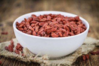 Goji Berries on a vintage background as detailed close-up shot (selective focus)