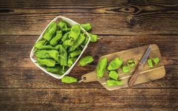 Raw Pimientos on a vintage background as detailed close-up shot, selective focus