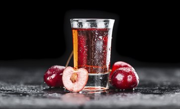 Some homemade Cherry Liqueur as detailed close-up shot, selective focus