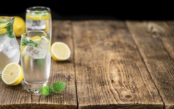 Homemade Lemonade on vintage background (selective focus, close-up shot)