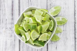 Portion of fresh Lime Slices (close-up shot, selective focus)