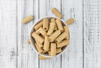 Sweet Wafers as high detailed close-up shot on a vintage wooden table, selective focus