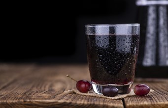 Some fresh Red Grape Juice (selective focus, close-up shot)