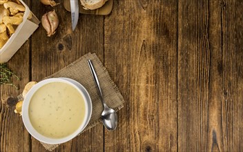 Fresh made Chanterelle Soup on a vintage background as detailed close-up shot