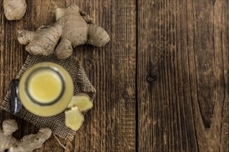 Portion of healthy Ginger Drink (selective focus, close-up shot)