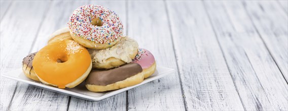 Portion of some Donuts as detailed close-up shot (fresh made, selective focus)