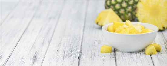 Fresh made Pineapple (sliced) on a vintage background as detailed close-up shot