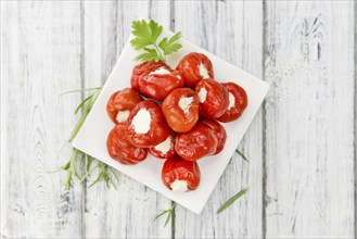 Some homemade Red Pepper (stuffed with cheese) (selective focus) as detailed close-up shot