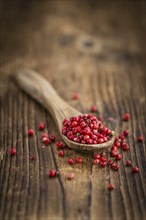 Portion of fresh Pink Peppercorns close-up shot, selective focus
