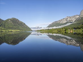 Morning atmosphere, reflection, early morning fog over the Grundlsee, panoramic shot,