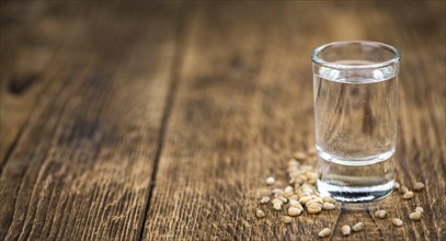 Portion of Wheat Liqueur as detailed close-up shot, selective focus