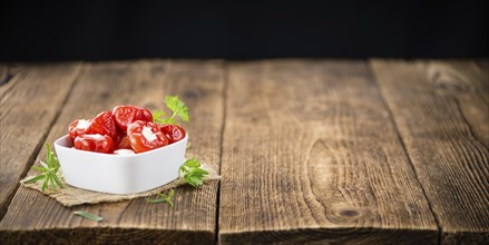 Some homemade Red Pepper (stuffed with cheese) (selective focus) as detailed close-up shot