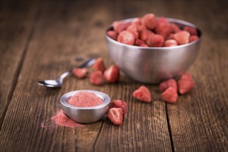 Fresh made Strawberry powder on a vintage background as detailed close-up shot