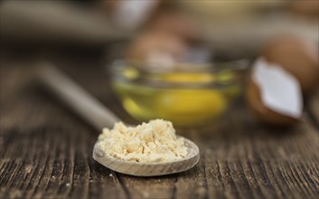 Vintage wooden table with Powdered Eggs (selective focus, close-up shot)