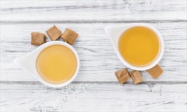 Portion of fresh Caramel Sirup (close-up shot, selective focus)