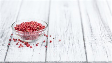 Portion of fresh Pink Peppercorns close-up shot, selective focus